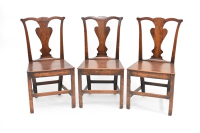 Lot 373 - A harlequin set of six 18th century oak standard chairs