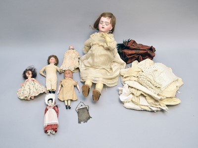 Lot 280 - A German porcelain-headed doll with other dolls and accessories