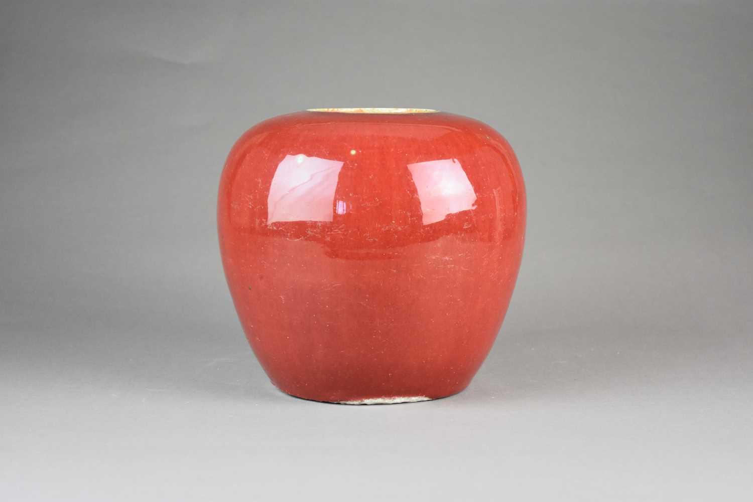 Lot 55 - A Chinese copper red glazed jar, Qing Dynasty