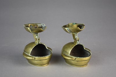Lot 447 - A pair of Chinese brass folding candle holders