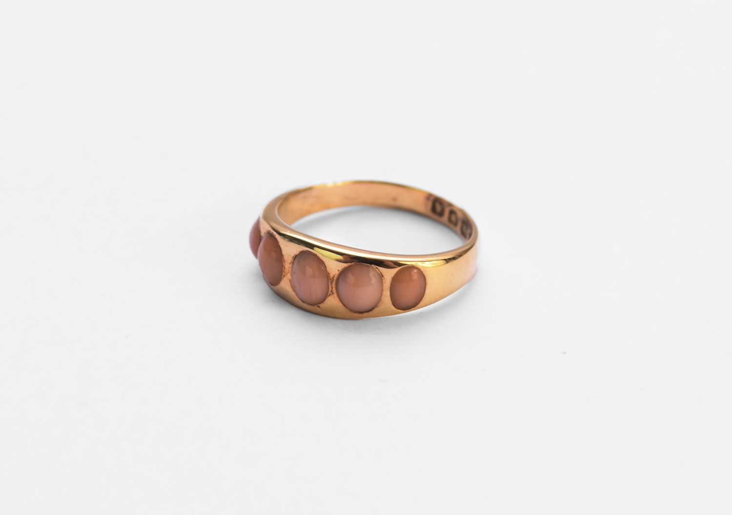 Lot 82 - A Victorian five stone coral ring