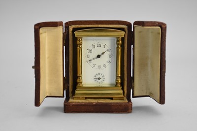 Lot 300 - A French gilt brass miniature carriage alarm clock