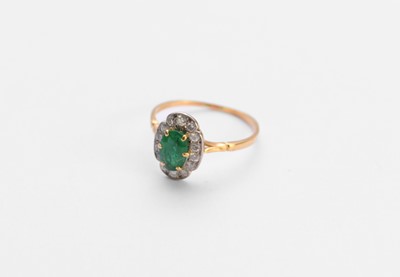 Lot 86 - An 18ct gold emerald and diamond ring