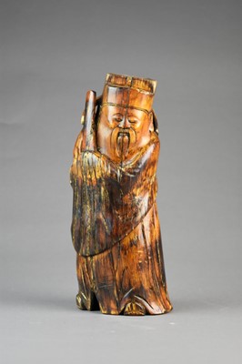 Lot 131 - A Chinese carved mammoth tusk figure of an immortal or scholar