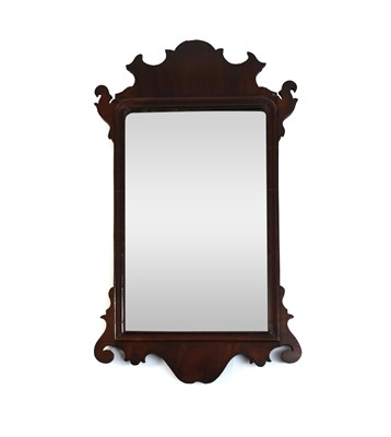 Lot 616 - A George III fret-type mirror and a pair of mahogany candlesticks