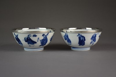 Lot 27 - A pair of Chinese blue and white 'immortals' bowls, Kangxi marks and period