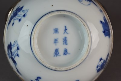 Lot 27 - A pair of Chinese blue and white 'immortals' bowls, Kangxi marks and period
