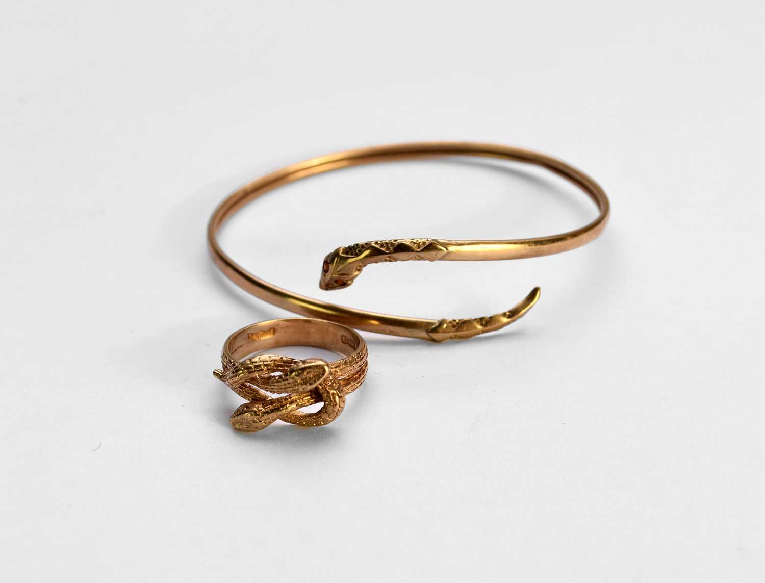 Lot 75 - A 9ct gold snake ring and bangle
