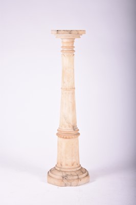 Lot 253 - A white marble torchere stand