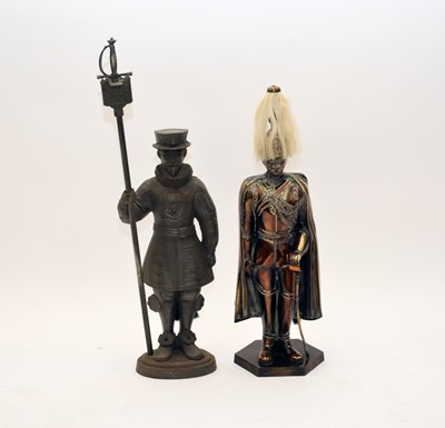 Lot 698 - Two cast iron standing fireside figural tool caddies