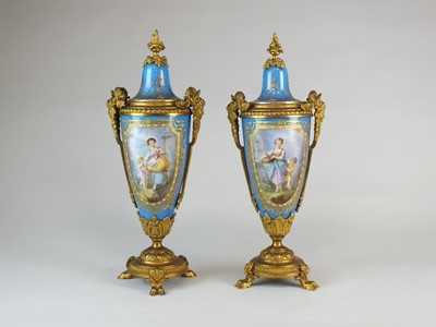 Lot 220 - A pair of French Sevres-style ormolu-mounted vases and covers