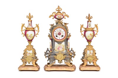 Lot 590 - A French ormolu and porcelain clock garniture