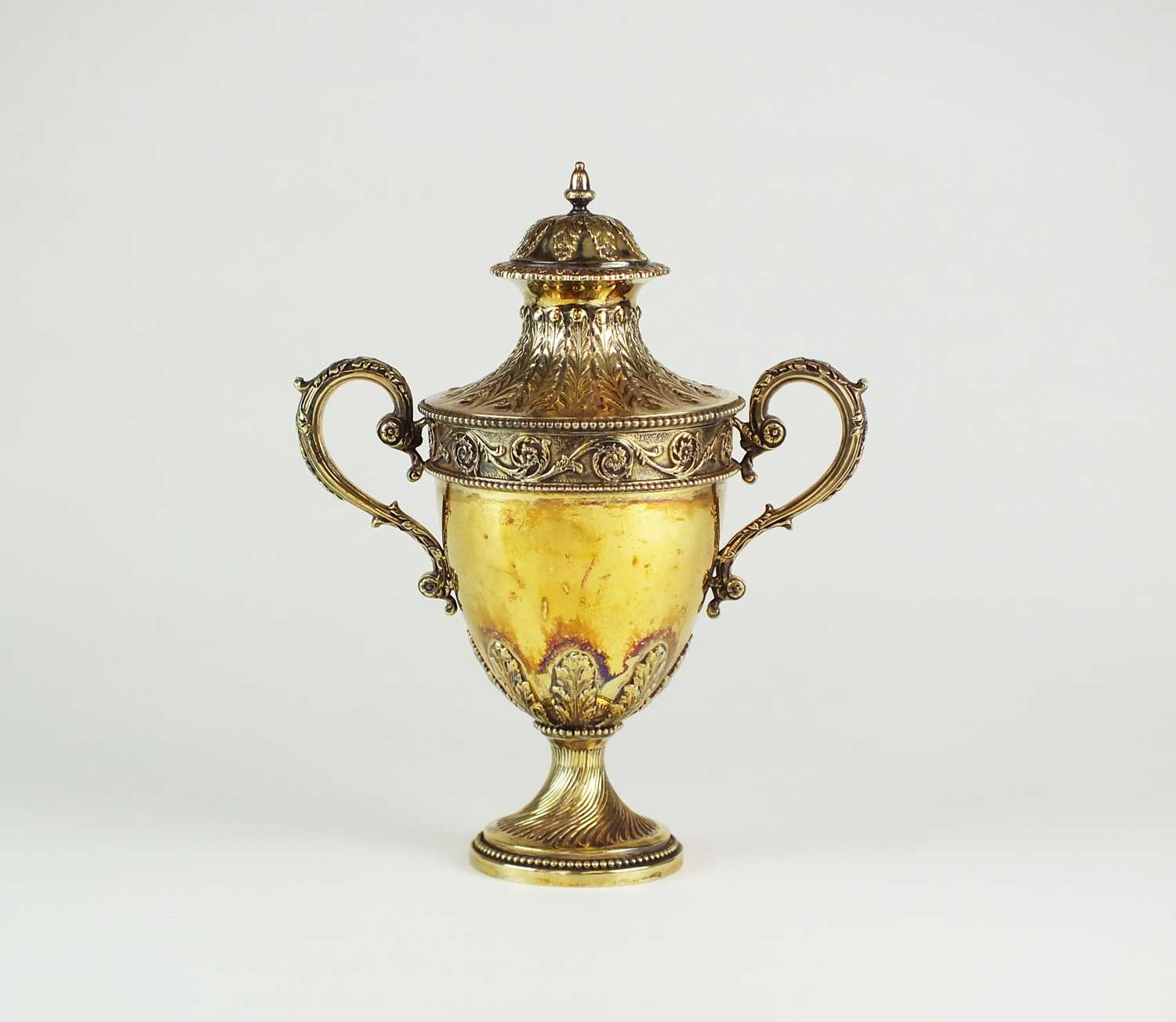 Lot 25 - A Victorian silver gilt two-handled cup and cover of urn form