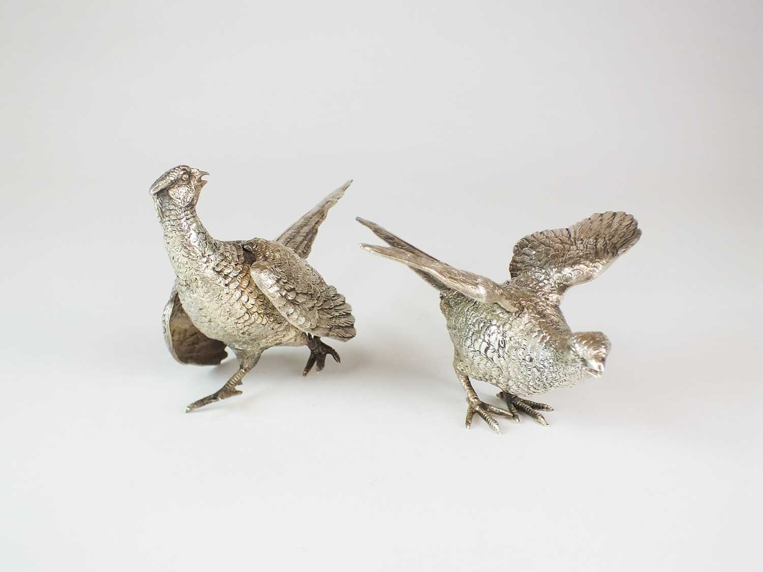 Lot 15 - A pair of silver ornaments modelled as pheasants