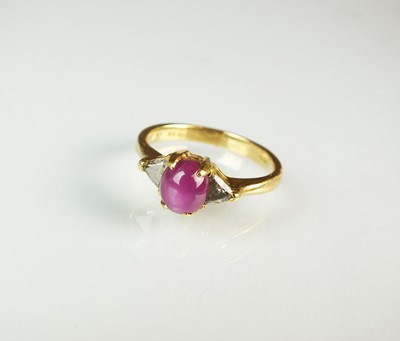 Lot 77 - A three stone star ruby and diamond ring