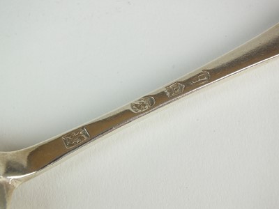 Lot 18 - A George I silver rat tail spoon by Samual Lee