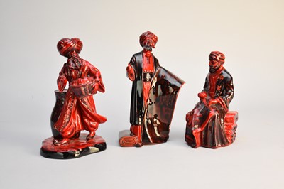 Lot 206 - Three Royal Doulton flambe figures