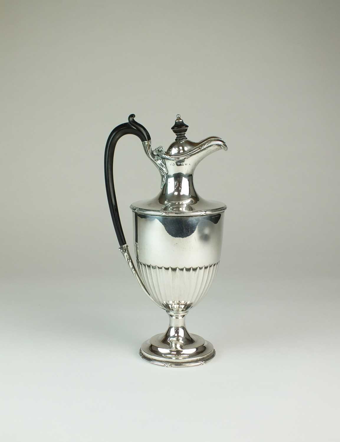 Lot 21 - An Edwardian silver hot water jug