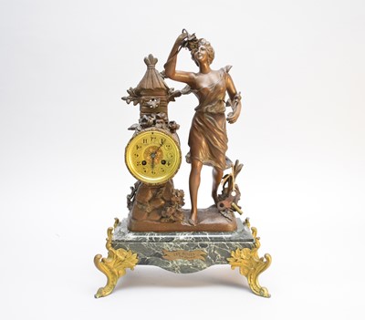 Lot 304 - Two French gilt metal and marble figural mantel clocks