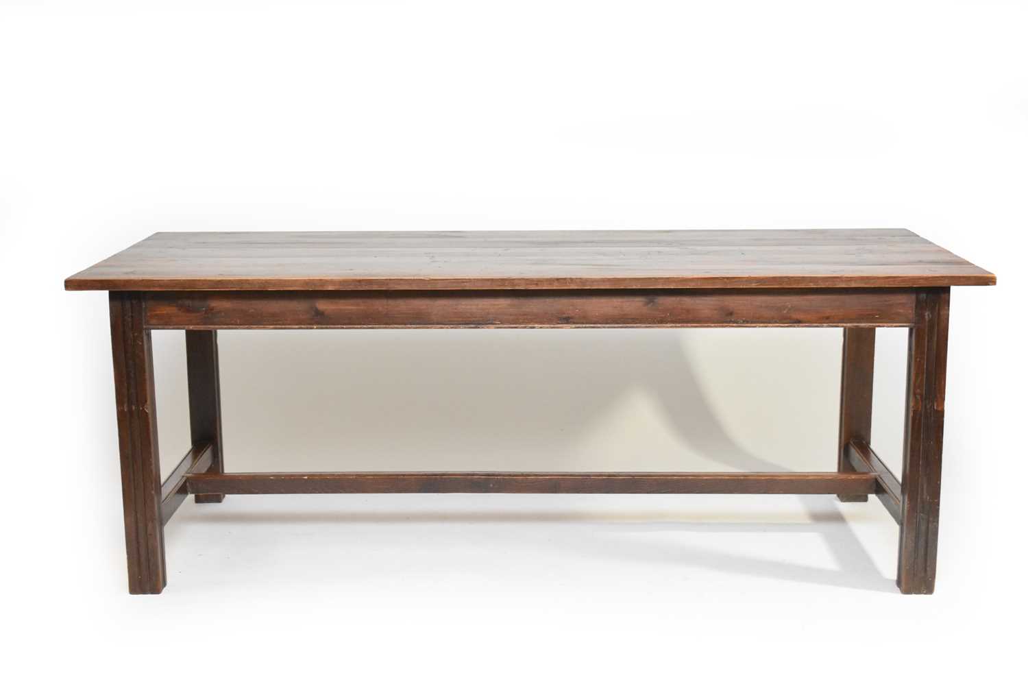 Lot 404 - A stained pine draw-leaf-type farmhouse kitchen table