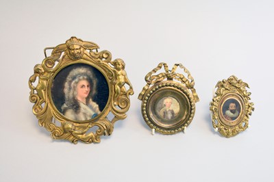 Lot 685 - Three various brass framed portrait miniatures