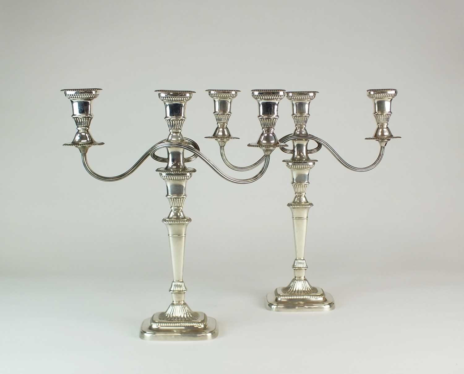 Lot 9 - A pair of silver candelabra