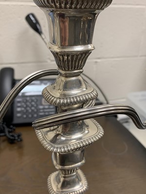 Lot 9 - A pair of silver candelabra