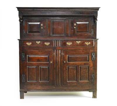 Lot 821 - An early 18th century oak court cupboard