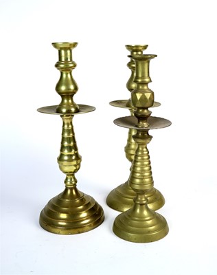 Lot 238 - A group of six similar oversized Eastern brass candle sticks