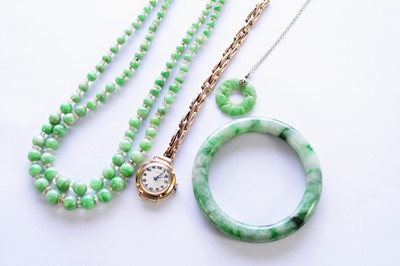 Lot 269 - A collection of jade jewellery, a watch and a gold charm