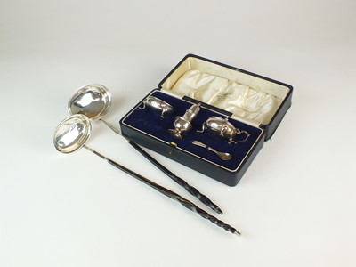 Lot 205 - A cased set of silver cruets and two toddy ladles