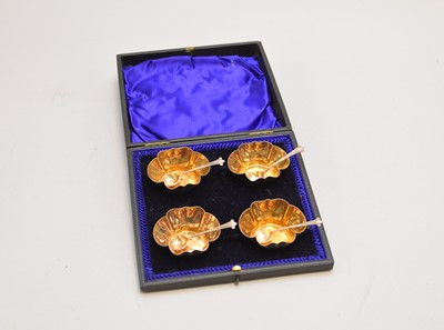 Lot 233 - An Edwardian cased set of four silver salts and spoons