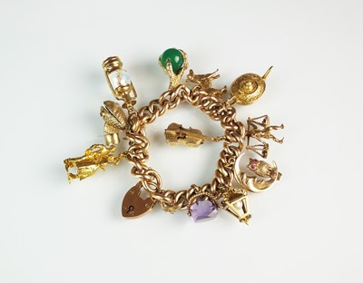 Lot 94 - A rose metal hollow curb link bracelet with attached charms