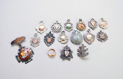 Lot 349 - A collection of fobs and badges