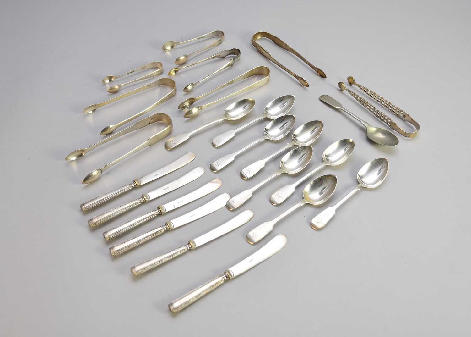 Lot 209 - A collection of silver spoons and sugar tongs