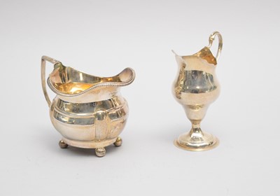 Lot 48 - Two George III silver cream jugs