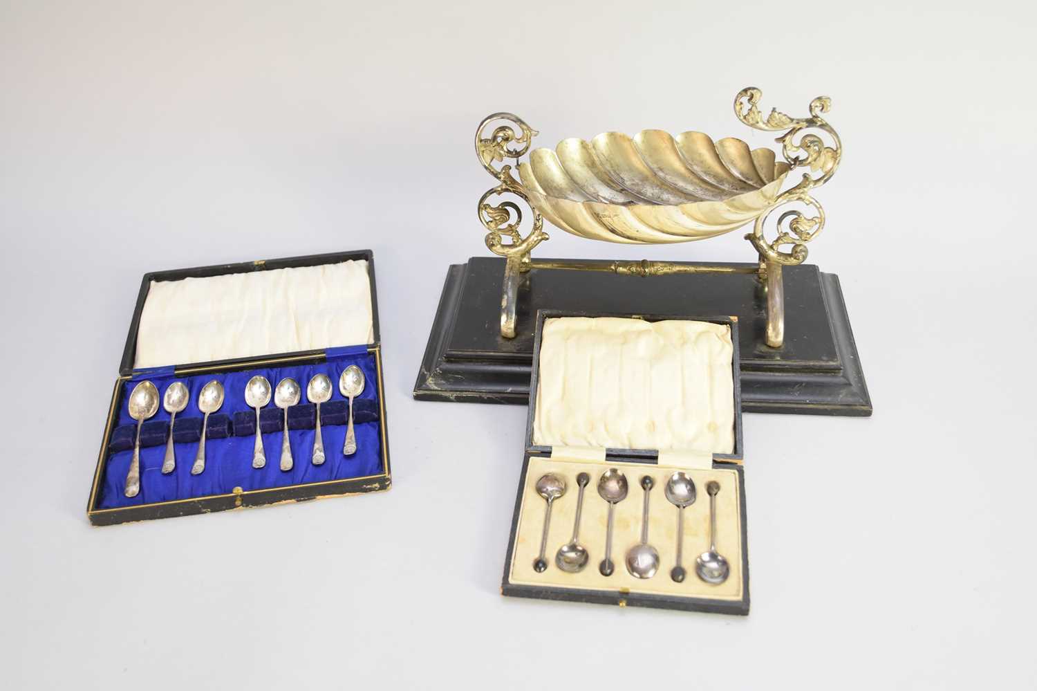 Lot 227 - An Edwardian silver swinging shell bowl/font and a collection of silver spoons