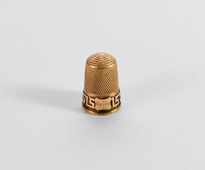 Lot 239 - A yellow metal thimble