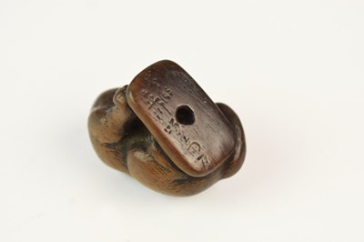 Lot 101 - A Japanese wood netsuke of a tiger, Meiji era