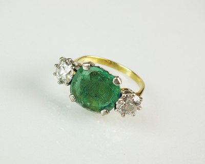 Lot 98 - A three stone emerald and diamond ring