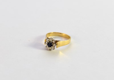 Lot 261 - An 18ct gold sapphire and diamond floral cluster ring