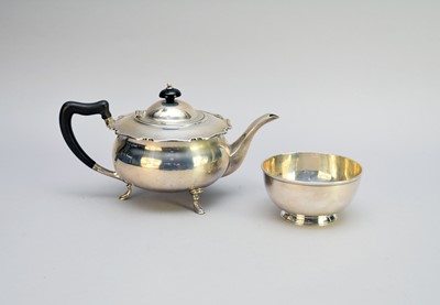 Lot 225 - A silver teapot and associated sugar bowl
