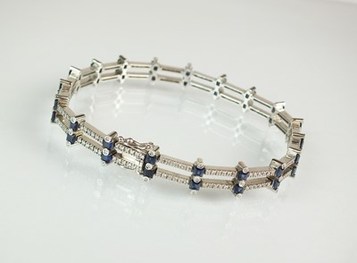 Lot 48 - A diamond and sapphire bracelet