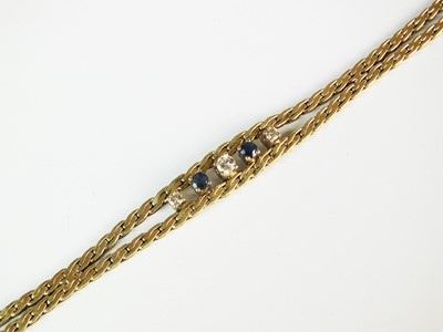 Lot 257 - A diamond and sapphire bracelet