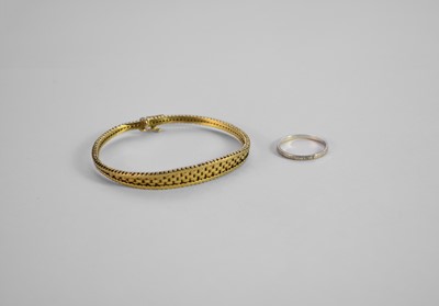 Lot 318 - A yellow metal bracelet and an 18ct white gold band