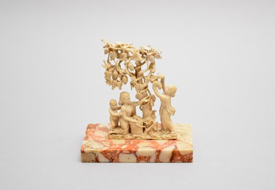 Lot 653 - An Indian ivory figure group, late 19th century