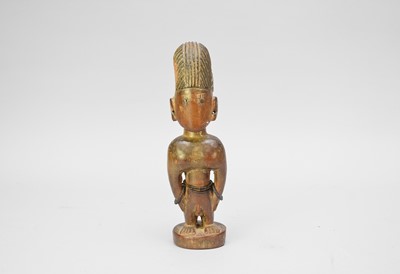 Lot 675 - A Yoruba tribal carved wood votive figure, West Africa