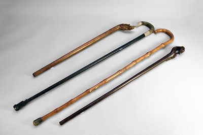 Lot 720 - A group of four various sticks and canes