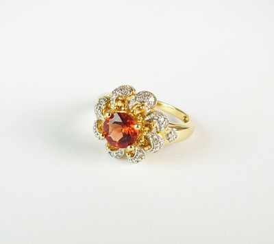 Lot 251 - An 18ct gold andesine, citrine and diamond cluster ring