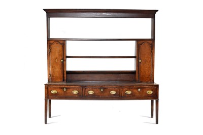 Lot 620 - A George III oak and mahogany cross-banded dresser, Shropshire